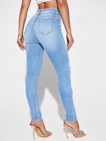 Jeans skinny strappati con vita alta