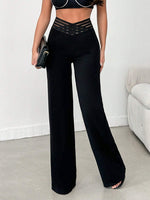 Pantalone Nero A Gamba Larga In Tessuto Di Lycra A Maglia Larga, Con Cintura Elastica A Righe Semi-trasparente E Vita A V