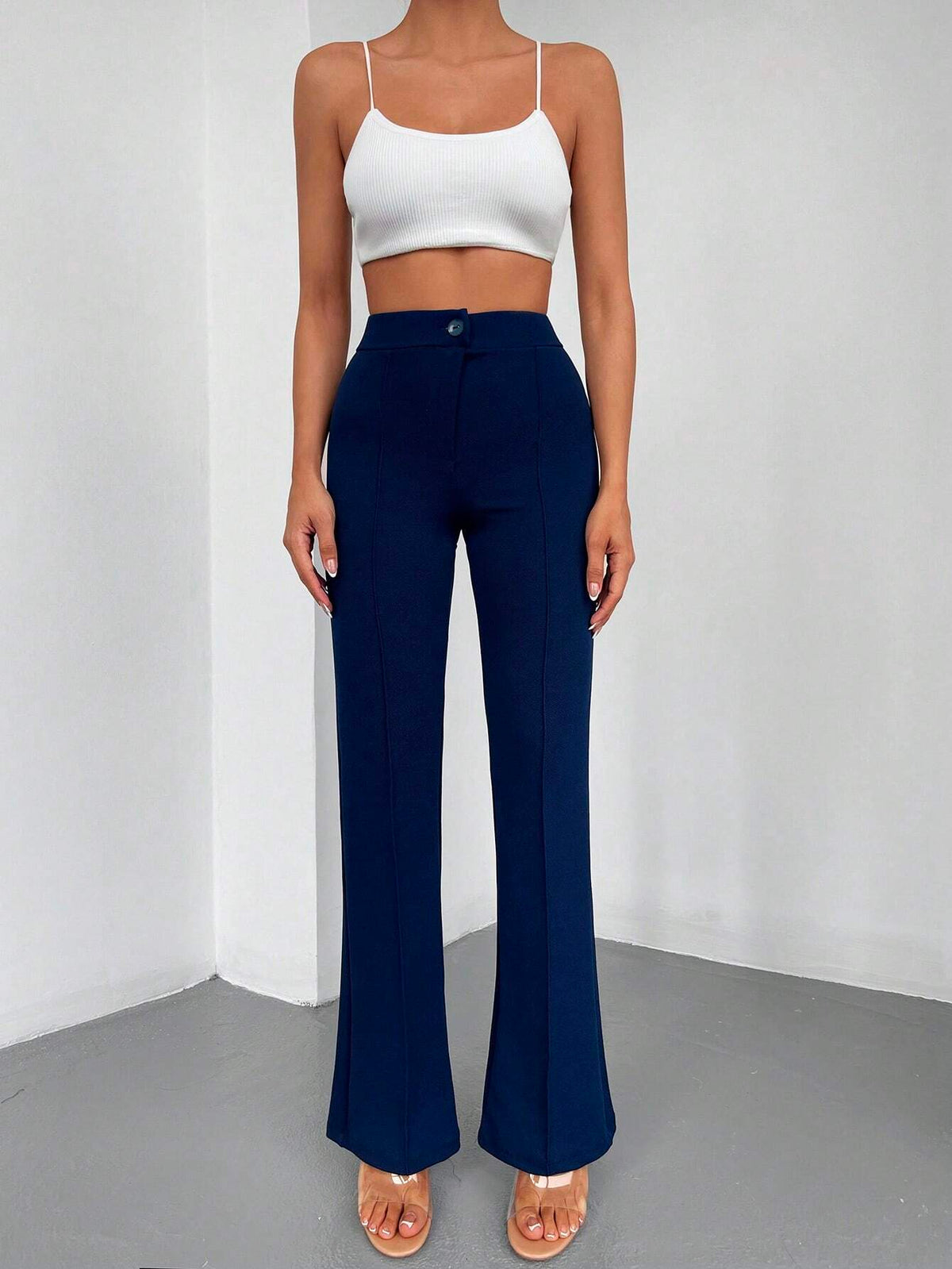 Pantaloni lunghi a svasatura eleganti a vita alta con bottoni e cerniere per le donne