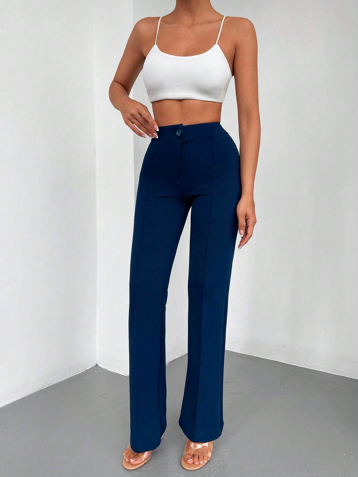 Pantaloni lunghi a svasatura eleganti a vita alta con bottoni e cerniere per le donne