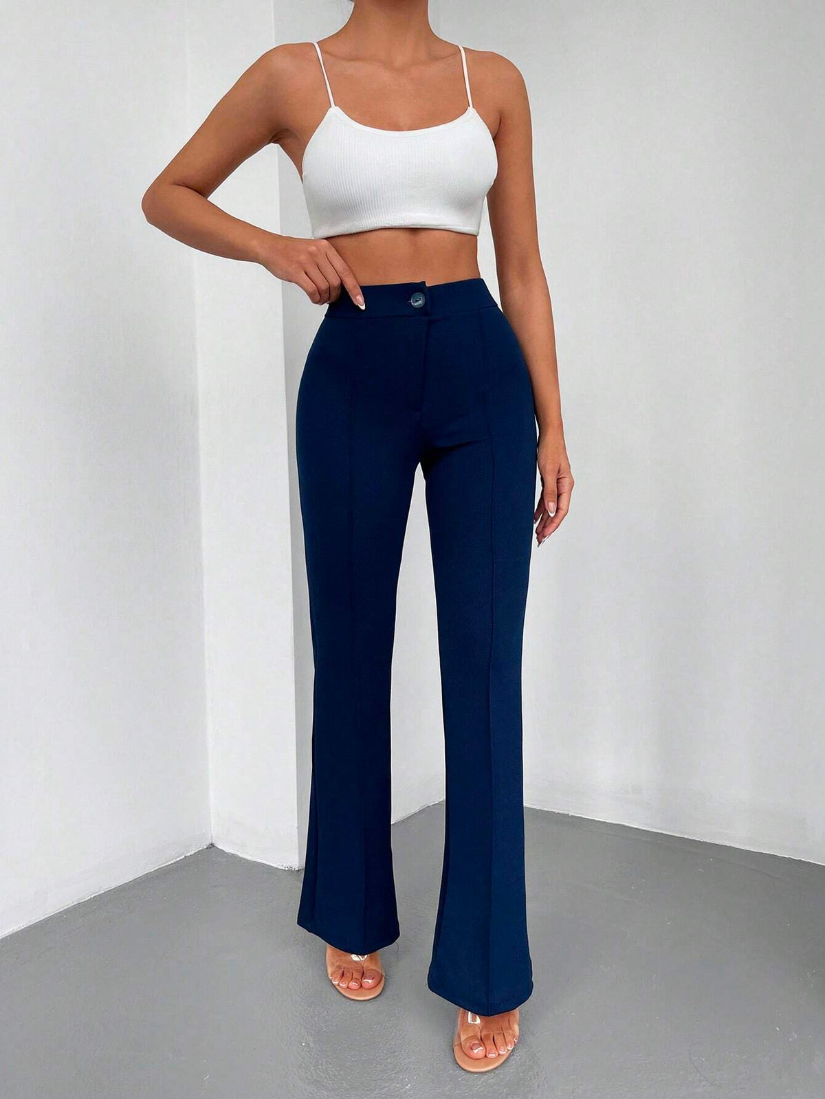 Pantaloni lunghi a svasatura eleganti a vita alta con bottoni e cerniere per le donne