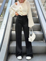 Pantaloni a zampa alta vita alta di colore unito da donna