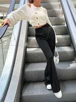 Pantaloni a zampa alta vita alta di colore unito da donna