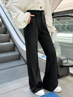 Pantaloni a zampa alta vita alta di colore unito da donna