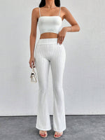 Pantaloni a zampa d'elefante in vita alta e lunghezza extra alta