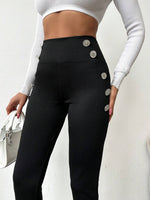 Pantaloni aderente vita alta dettaglio bottone