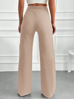 Pantaloni vita alta con bottone frontale