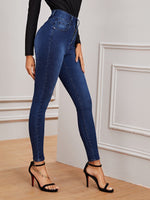 Jeans aderenti lavati buio con bottone