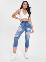 Jeans skinny strappati tasca inclinata
