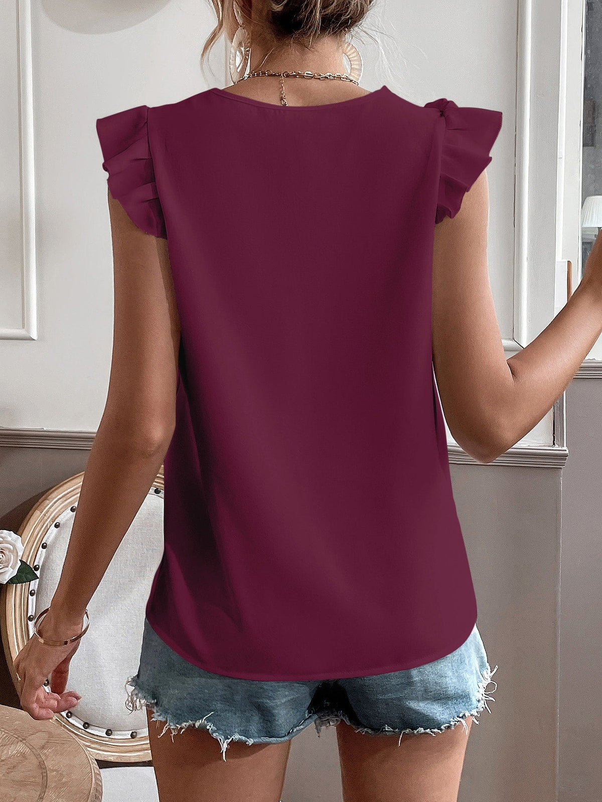 Camicetta con bordo di pizzo manica ad aletta