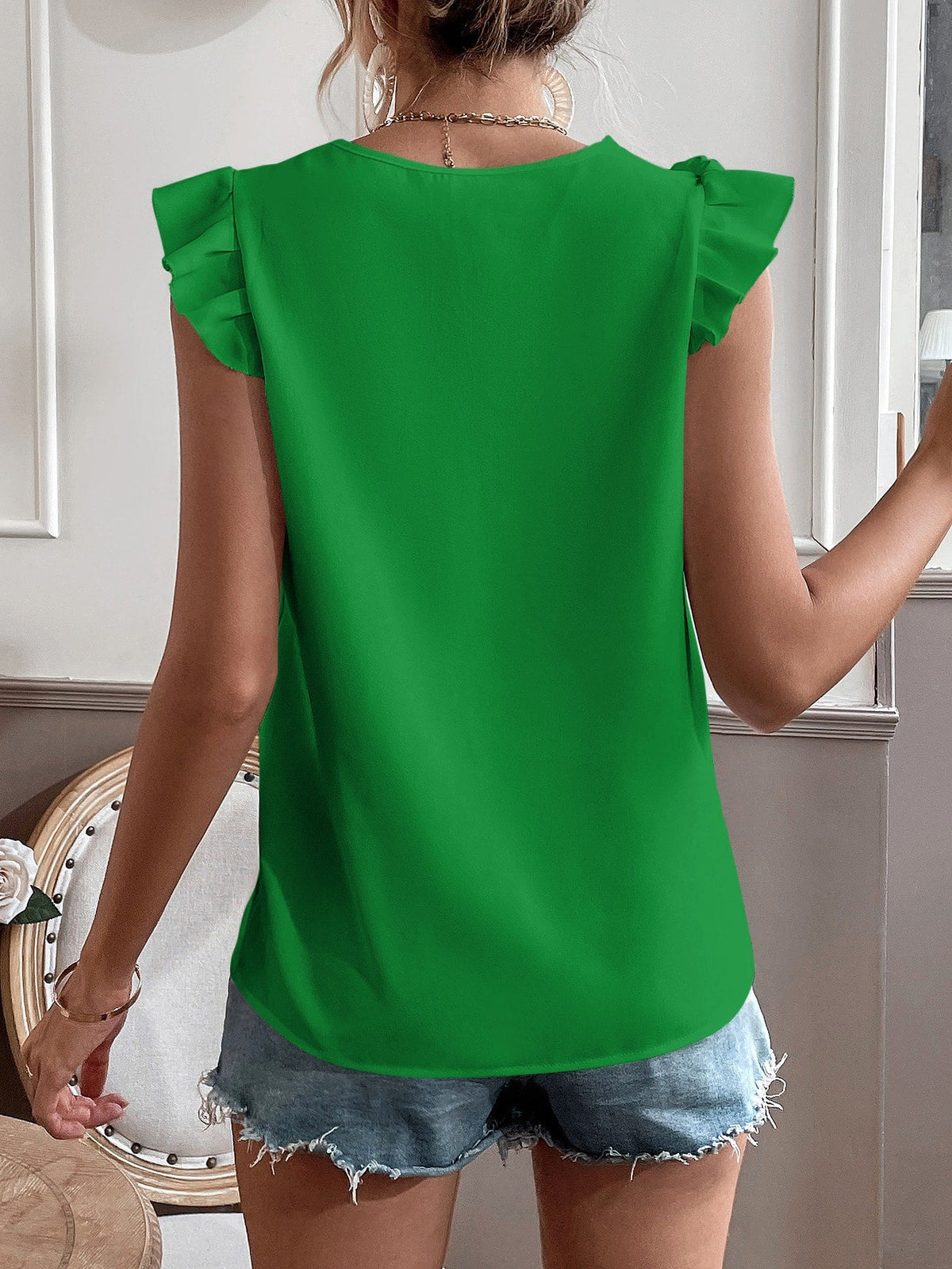 Camicetta con bordo di pizzo manica ad aletta