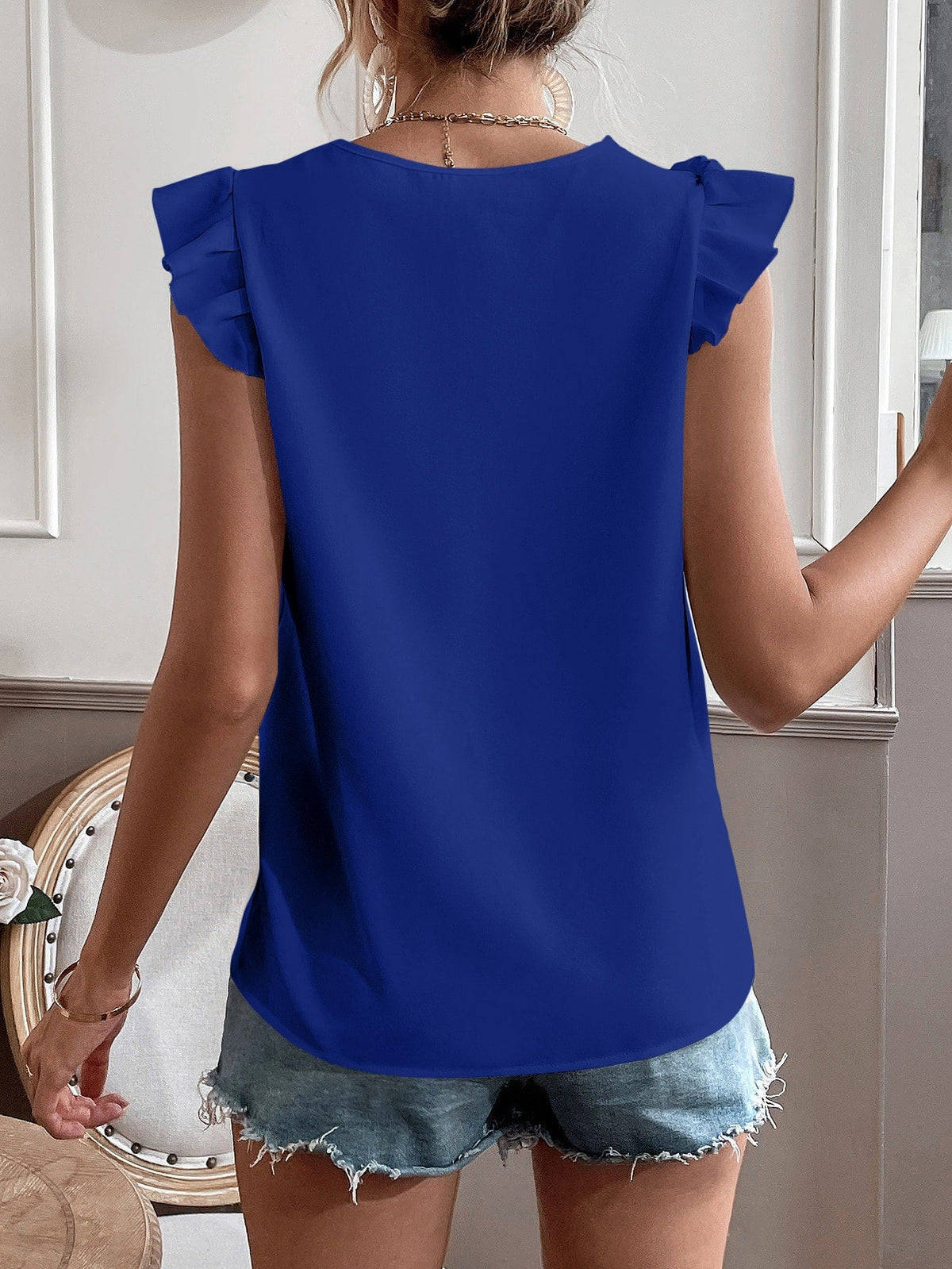 Camicetta con bordo di pizzo manica ad aletta