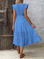 Abito incrociato monocolore con bordo a volant