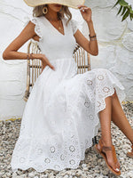 Abiti ricamo ad occhielli con bordo a volant