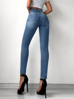 Jeans skinny con bottone