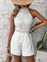 Tutina ricamo ad occhielli zip retro con collo halter