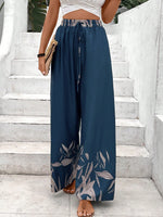 Pantaloni a gamba larga a vita alta con stampa floreale e dettaglio di fiocco sul davanti per donne, neri