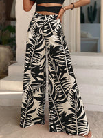 Pantaloni a gamba larga con stampa tropicale