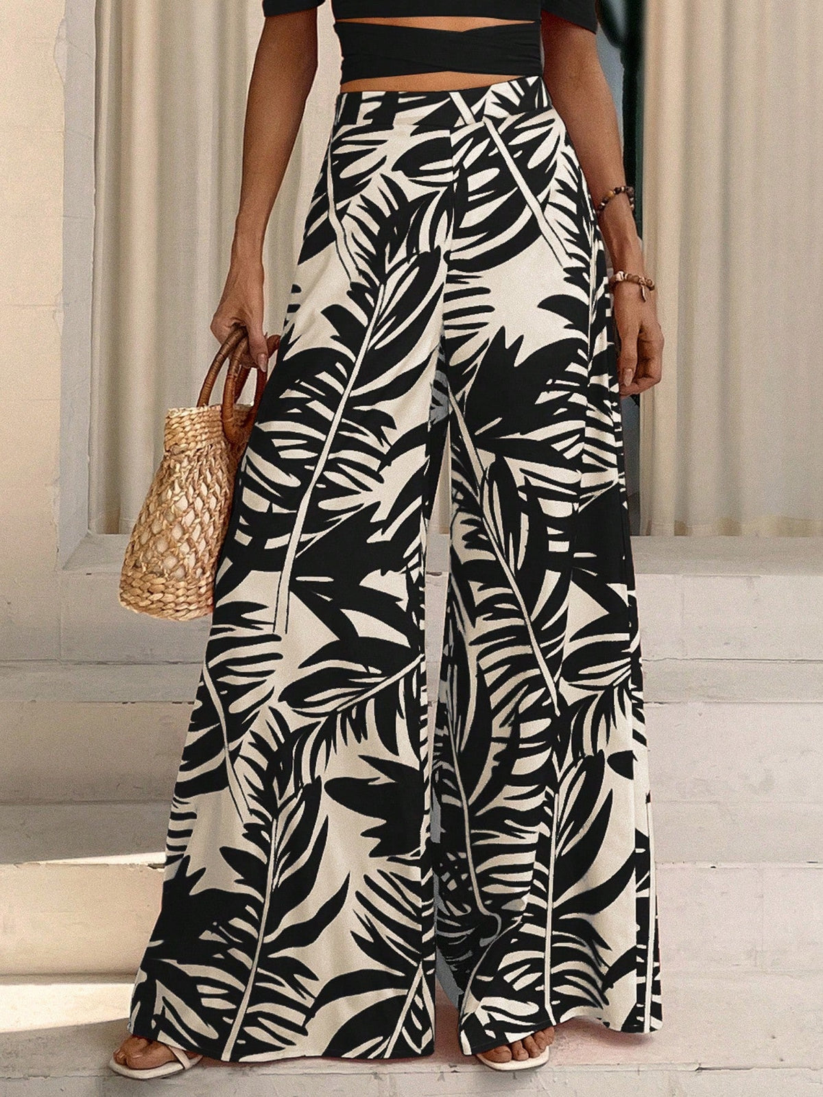 Pantaloni a gamba larga con stampa tropicale