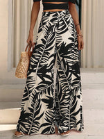 Pantaloni a gamba larga con stampa tropicale