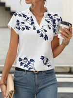 Camicetta con stampa floreale con manica a pipistrello scollo dentellato