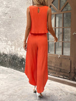 Top di stile vacanziero elegante stampato a pois per signore con pantaloni a gamba larga con spacco avanti