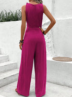 Salopette blu navy con scollo a V e cinturino intrecciato per donne