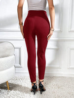 Pantaloni aderente con bottone