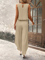 Top di stile vacanziero elegante stampato a pois per signore con pantaloni a gamba larga con spacco avanti