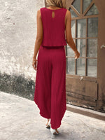 Top di stile vacanziero elegante stampato a pois per signore con pantaloni a gamba larga con spacco avanti