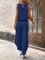 Top di stile vacanziero elegante stampato a pois per signore con pantaloni a gamba larga con spacco avanti