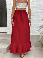 Gonna con orlo a fessura vita alta con bordo a volant