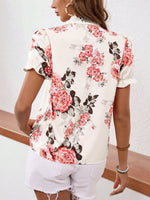 Camicetta con stampa floreale con cravatta al collo con manica a sbuffo