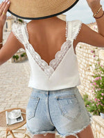 Elegante Top Con Maniche A Cappuccio E Spacco In Pizzo