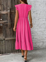 Abito incrociato monocolore con bordo a volant