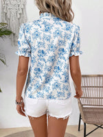 Camicetta con stampa floreale con cravatta al collo con manica a sbuffo