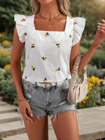 Blusa estiva casual da donna con ricamo floreale, scollo a quadrato, orlo a volant e decorazione per le vacanze