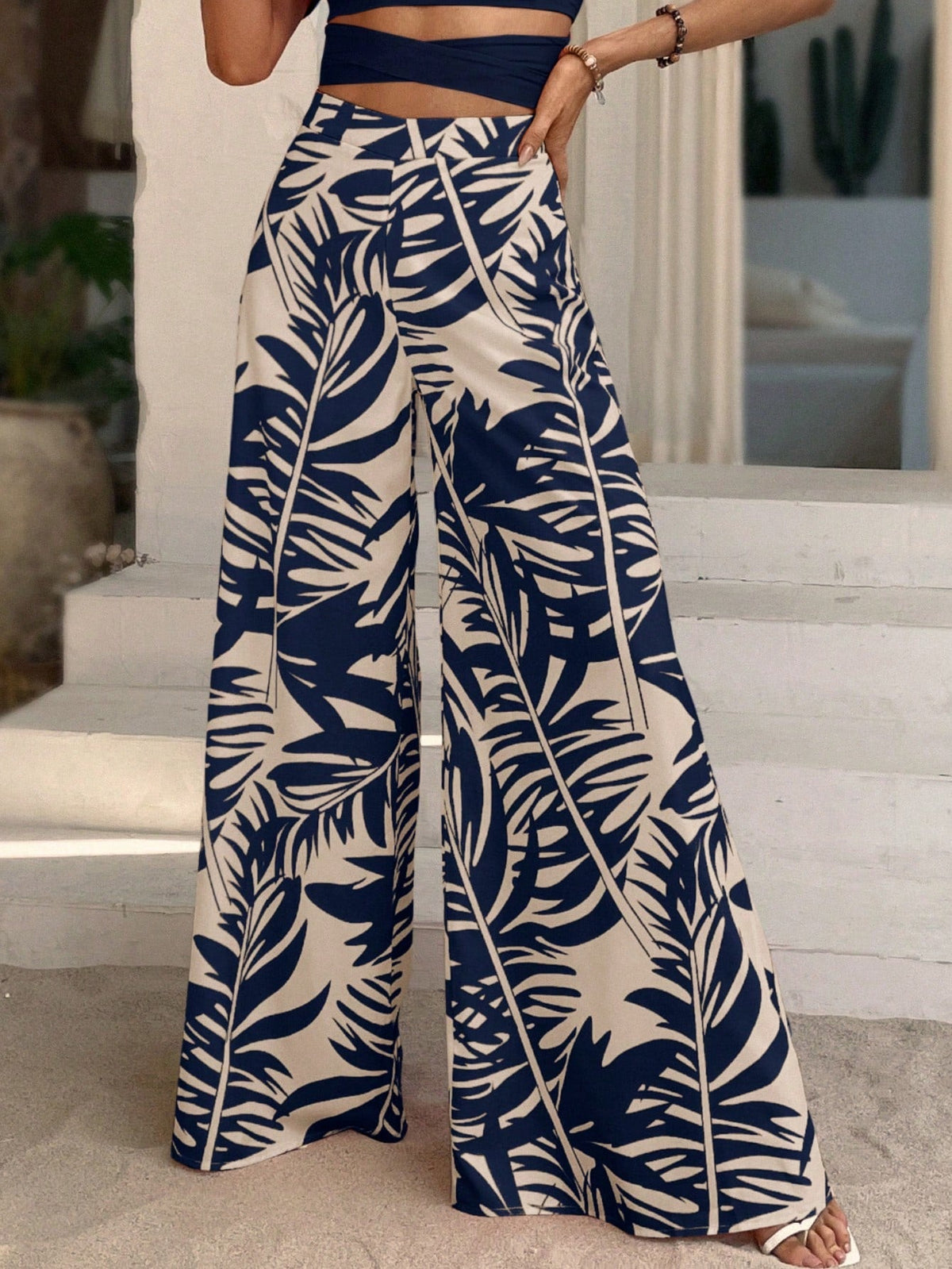 Pantaloni a gamba larga con stampa tropicale