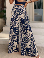 Pantaloni a gamba larga con stampa tropicale