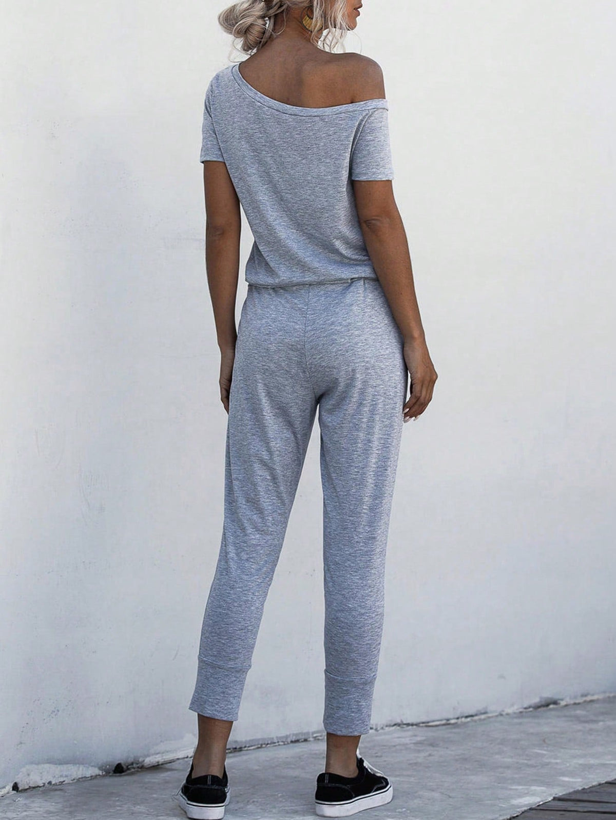 Jumpsuit Maglietta monocolore scollatura asimmetrica con coulisse a vita tasca inclinata