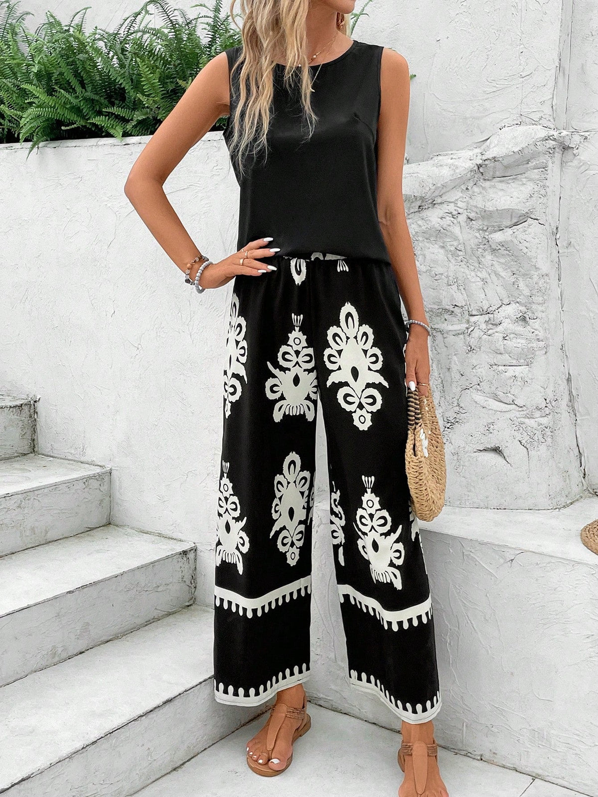 Top senza maniche alla moda di colore solido per donne e pantaloni a gamba dritta stampati