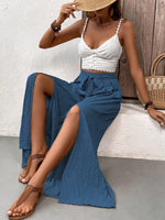 Pantalone casual estivo in tessuto a pieghe solido con vestibilitˆ ampia e taglio largo diviso