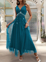 Abito con sovrapposizione a maglia di perline di perle