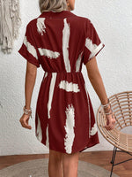 Abito incrociato con stampa pennellate con manica a pipistrello nodo laterale