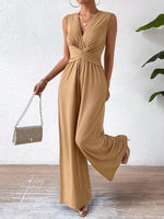 Tuta femminile senza maniche con vita incrociata elegante