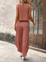 Top di stile vacanziero elegante stampato a pois per signore con pantaloni a gamba larga con spacco avanti