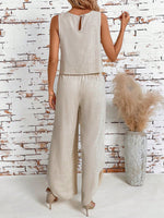 Top di stile vacanziero elegante stampato a pois per signore con pantaloni a gamba larga con spacco avanti