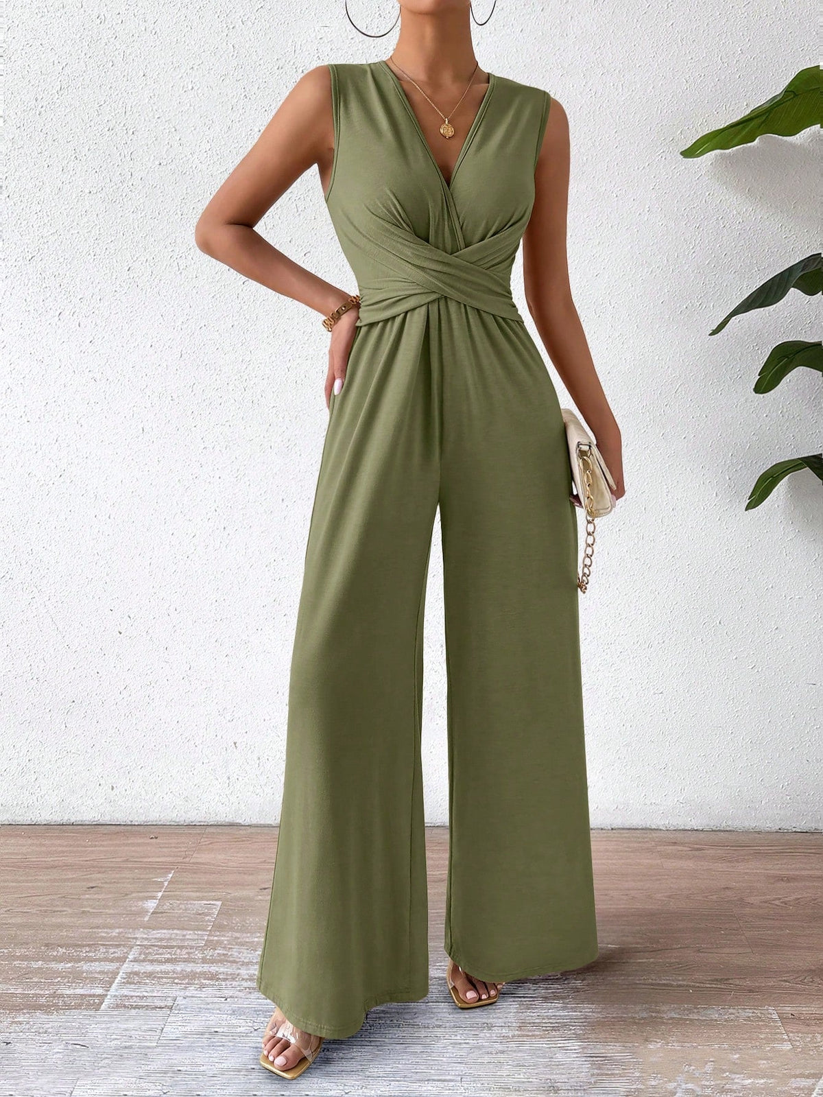 Tuta femminile senza maniche con vita incrociata elegante