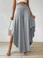 Pantaloni a gamba larga vita alta orlo asimmetrico