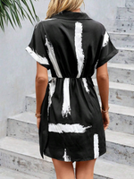 Abito incrociato con stampa pennellate con manica a pipistrello nodo laterale